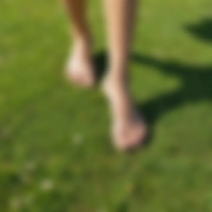 Person walking barefoot on grass