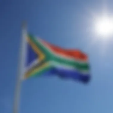 The South African flag waving proudly against a blue sky