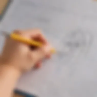 Close-up of a child's hand holding a pencil on a tracer page